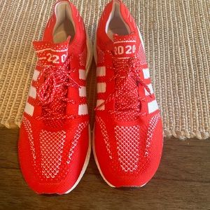 Red and white adidas ultra boost